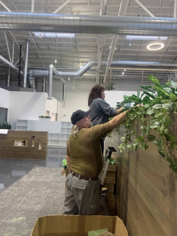 Marie and JR installing trailing Plants